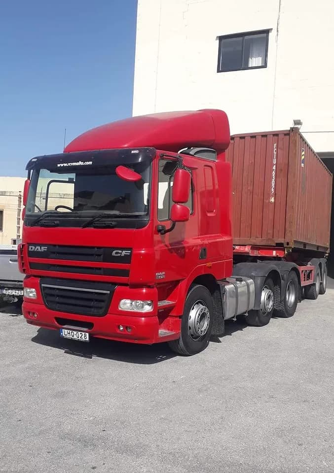 CTS Transport red DAF CF truck hauling shipping container