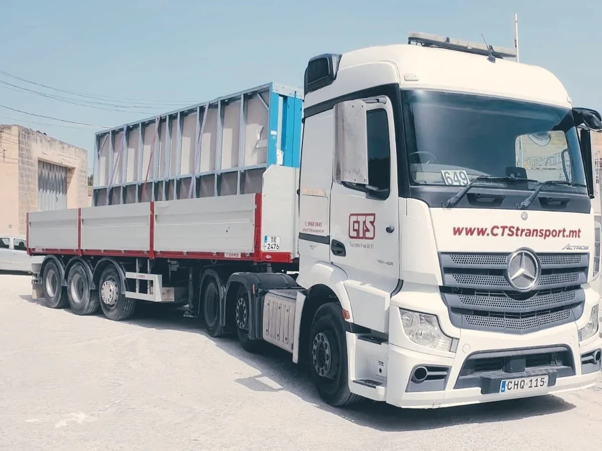 CTS Transport branded white Mercedes-Benz Actros with flatbed trailer